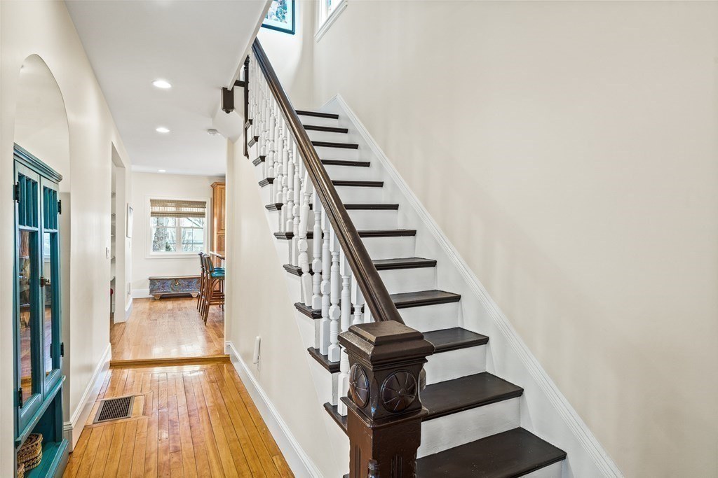Custom stair millwork and newel post detail by Ferragamo Builders in Melrose, MA
